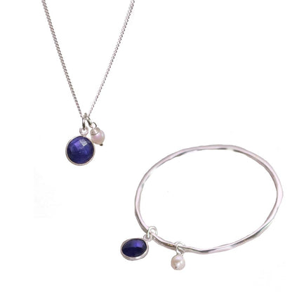 silver sapphire charm bangle and necklace with silver pearl attached 
