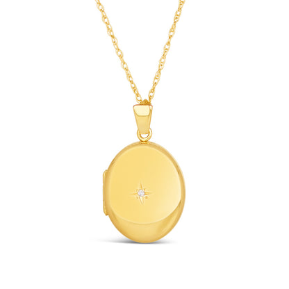 diamond oval locket in gold on a white background