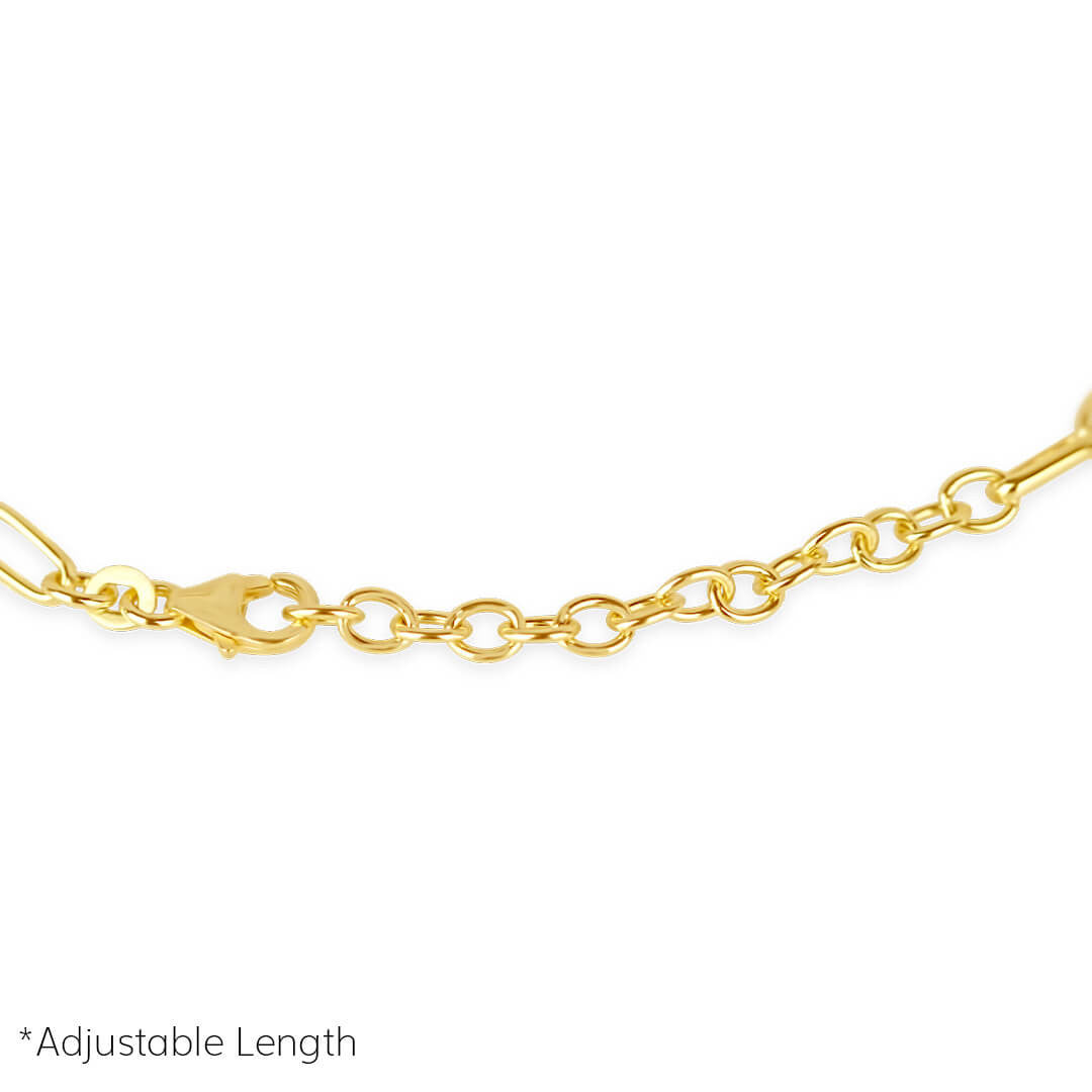 closeup of men's paperclip chain bracelet in gold on a white background