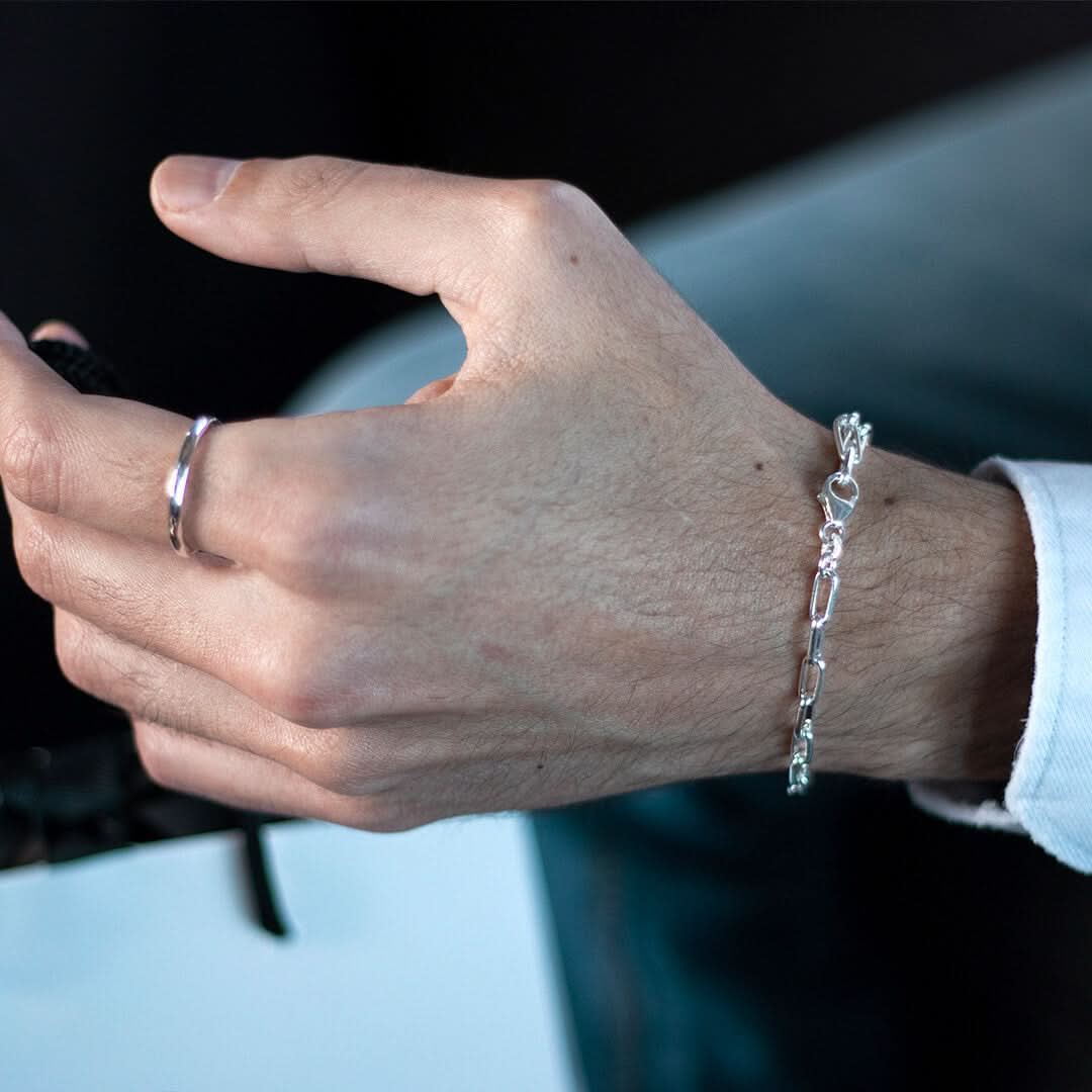 model wearing men's paperclip chain bracelet in silver