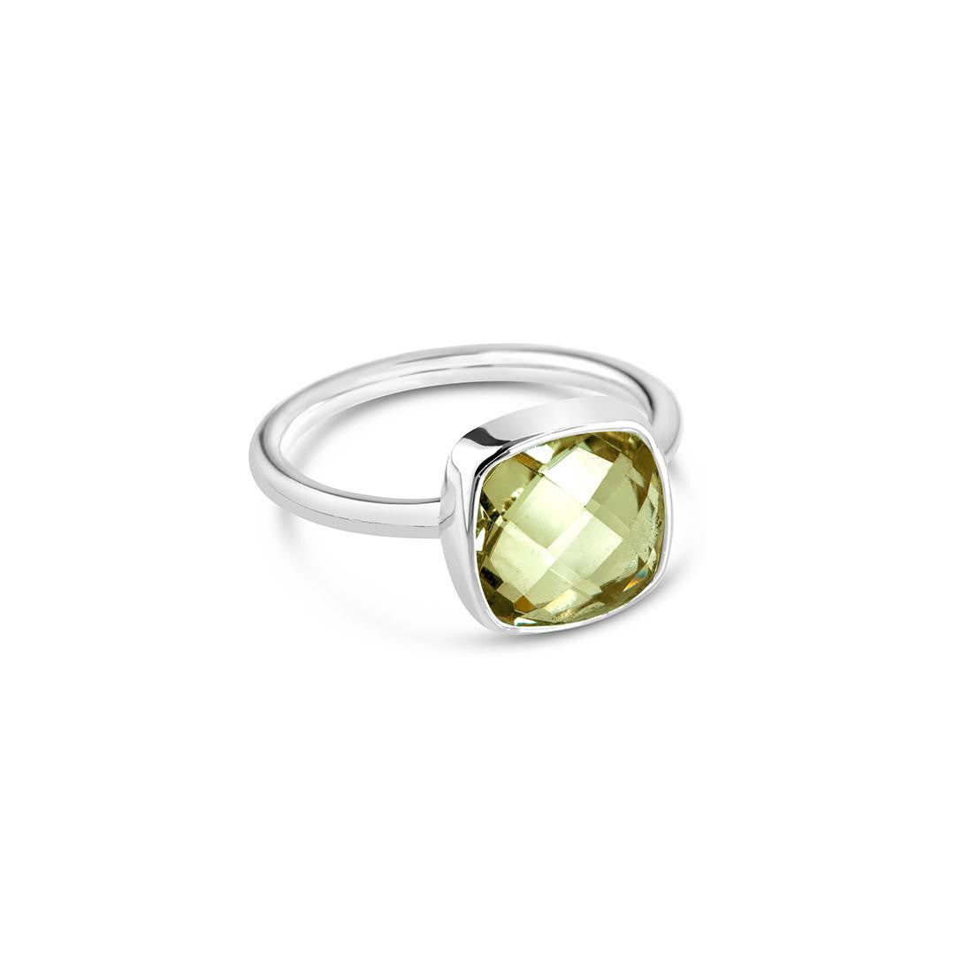 green amethyst cocktail ring in silver on a white background