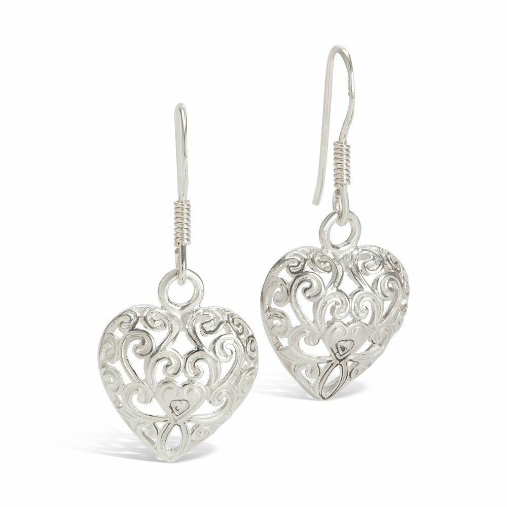 silver heart earrings on a white background 