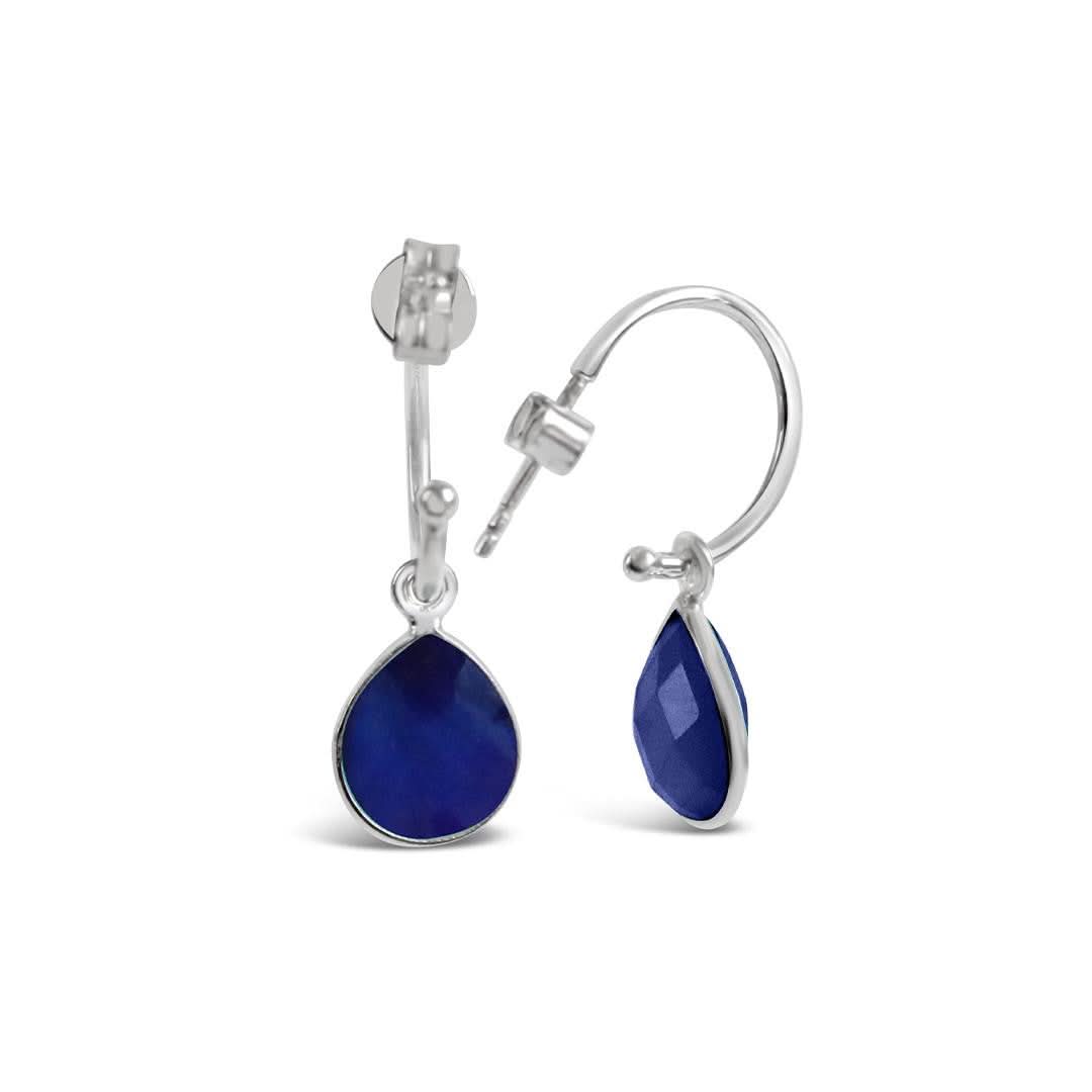 sapphire drop hoop earrings in silver on a white background
