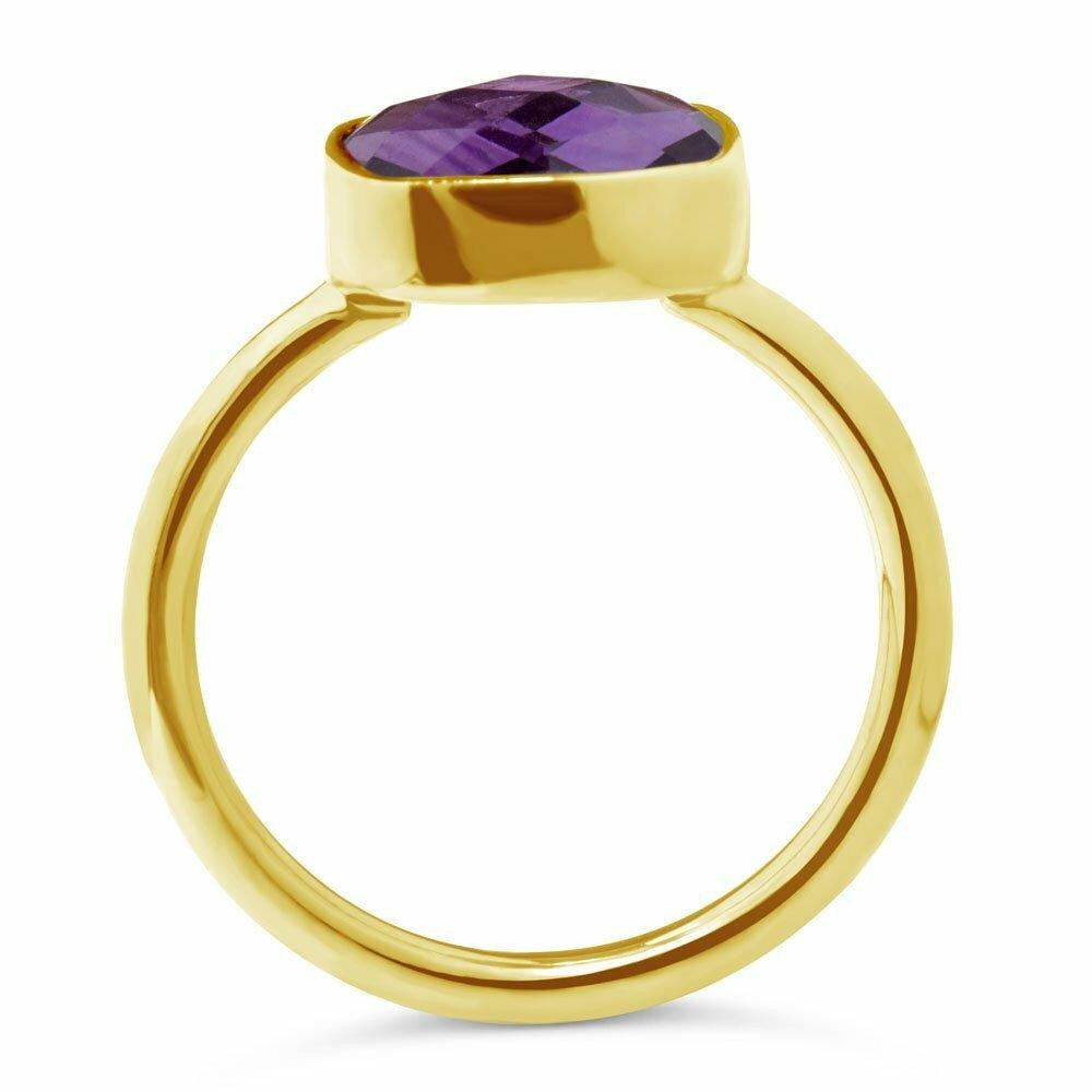 purple amethyst cocktail ring in gold on a white background
