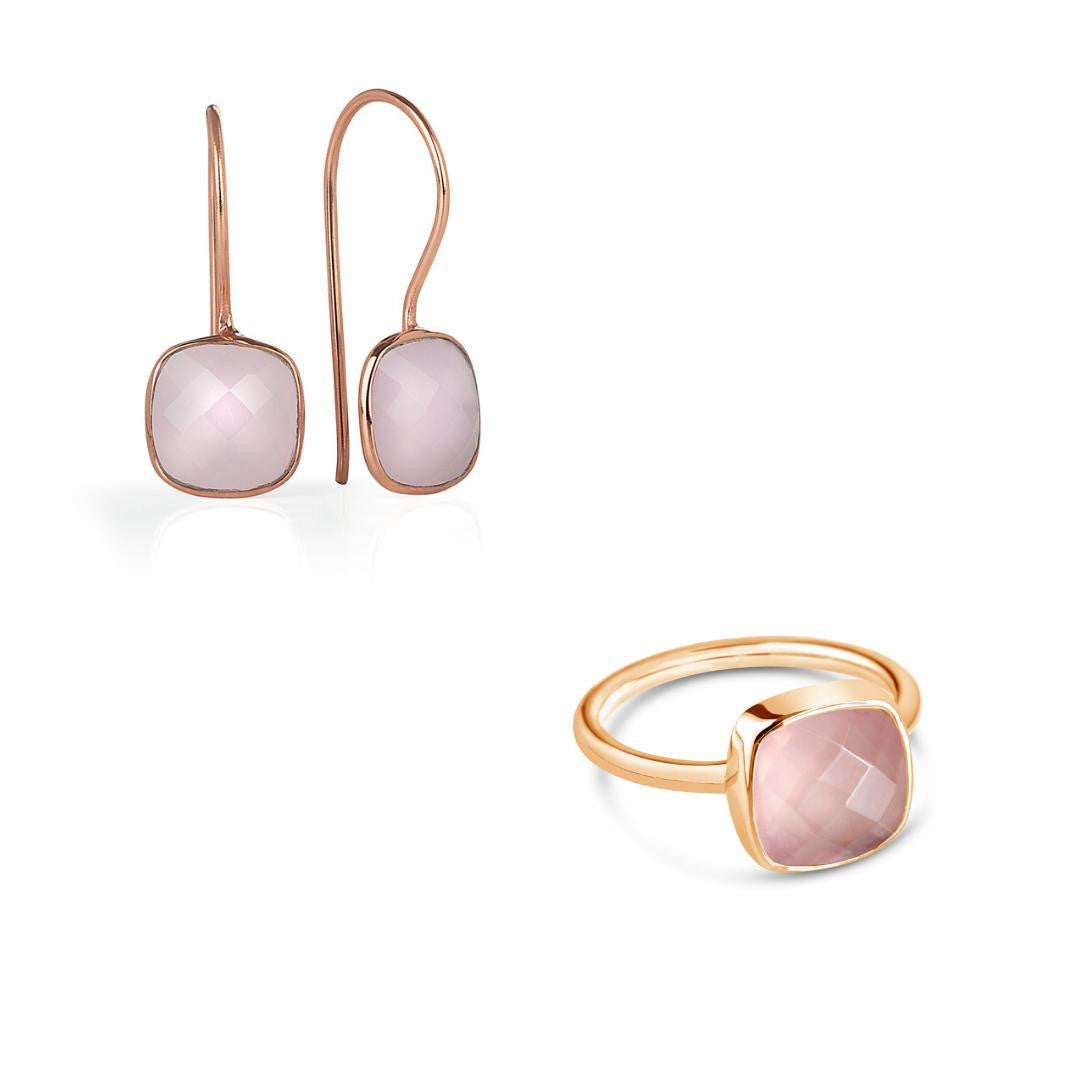 rose quartz cocktail ring in rose gold with matching earrings on a white background