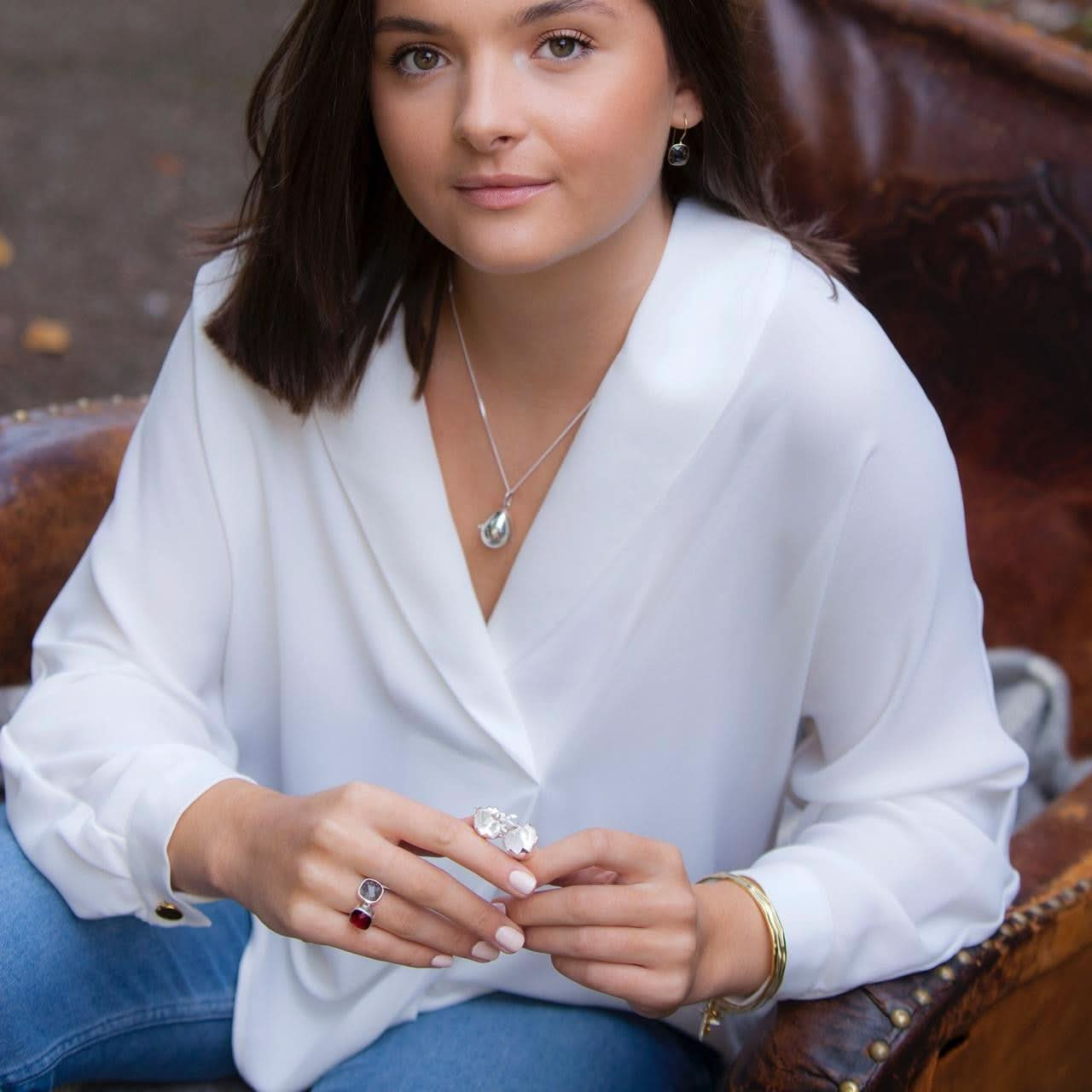 model holding opened charming chick locket in silver