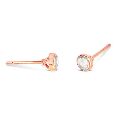 White quartz mini studs in rose gold facing the side on a white background