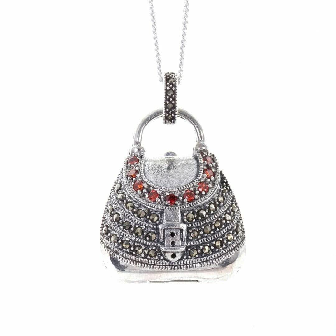 garnet handbag locket in silver on a white background