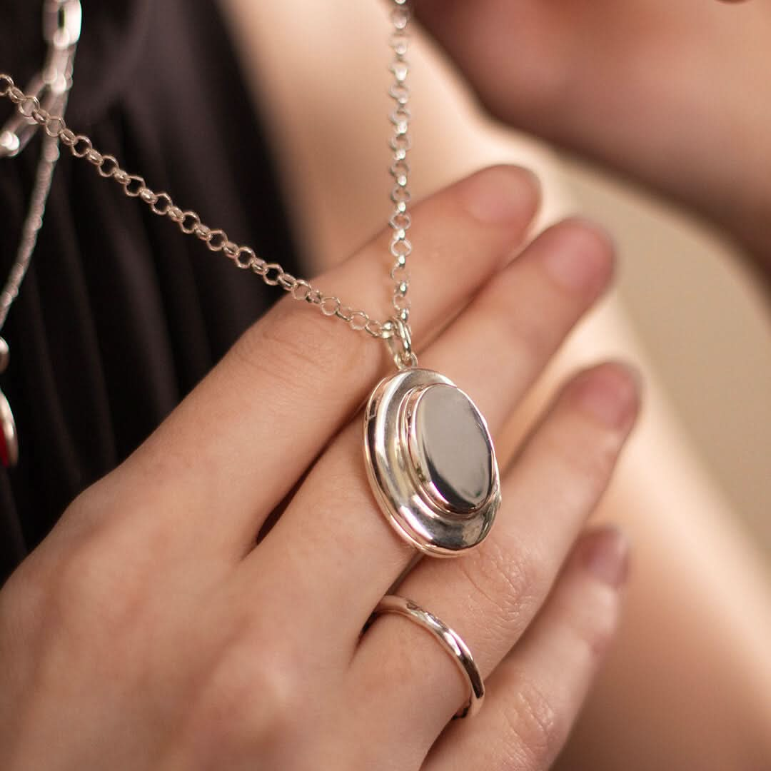 model wearing mum locket in silver with a belcher chain