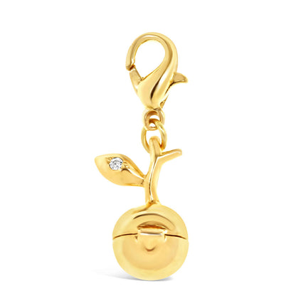 magical apple charm in gold on a white background