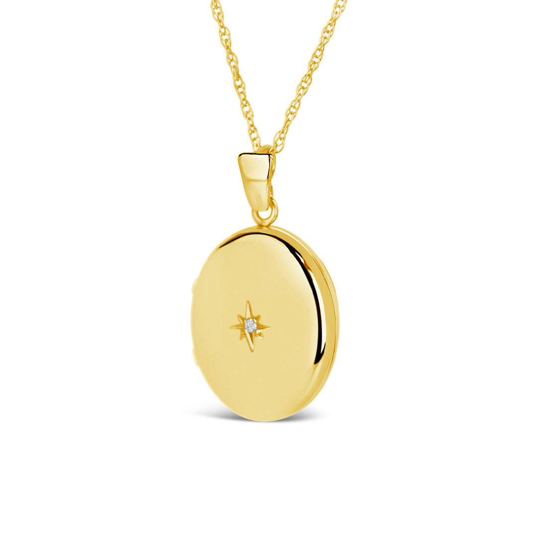 diamond oval locket in gold on a white background