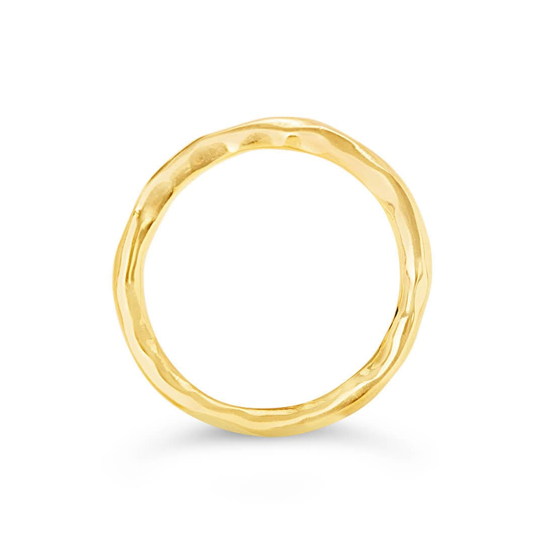 men's hammered gold ring from the front on a white background 