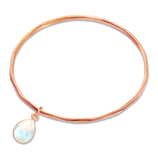 moonstone charm bangle in rose gold on a white background