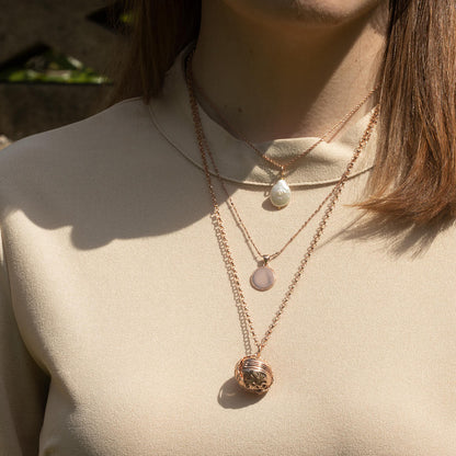 model wearing rose gold belcher chain with rose gold memory keeper locket