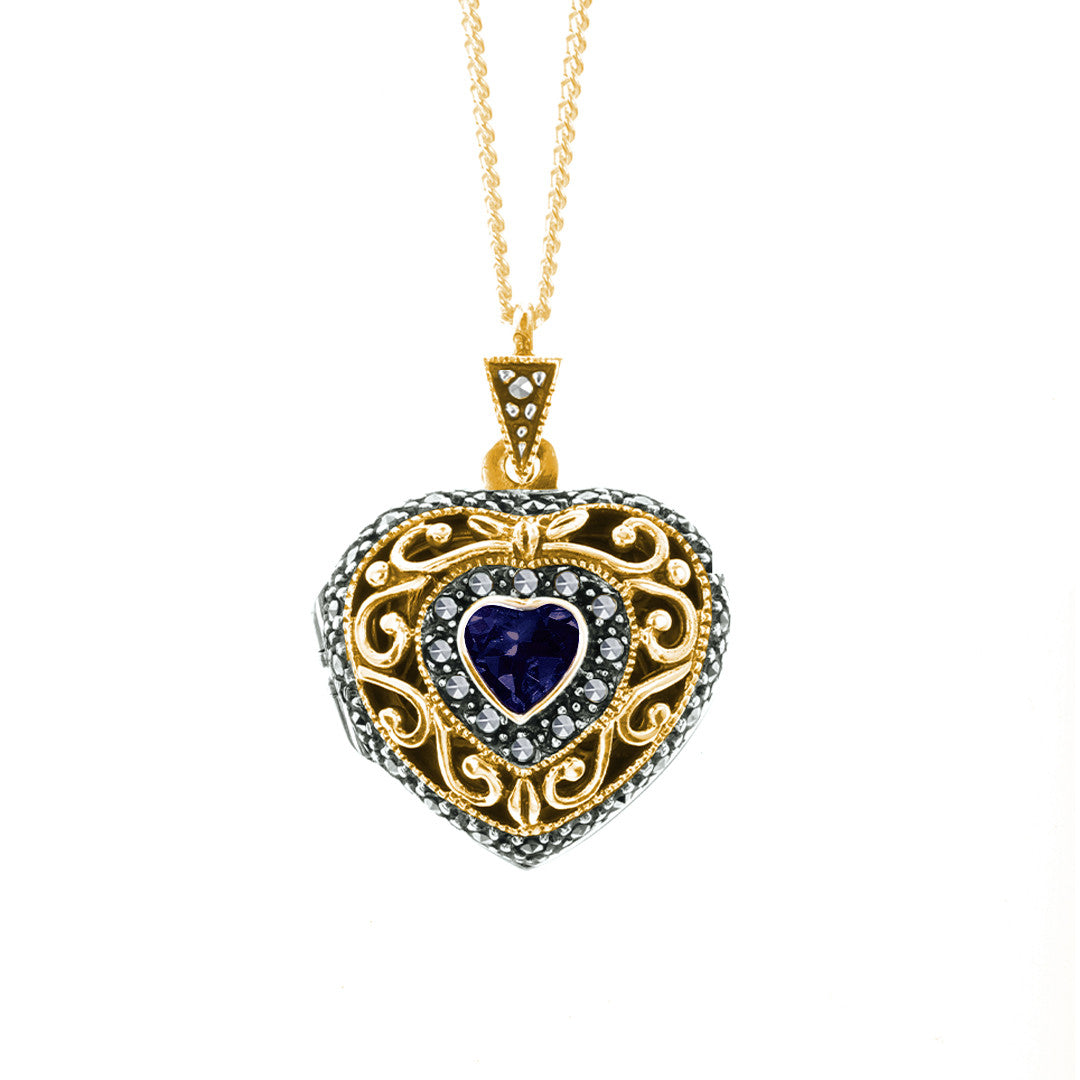 sapphire vintage heart locket with gold chain on a white background