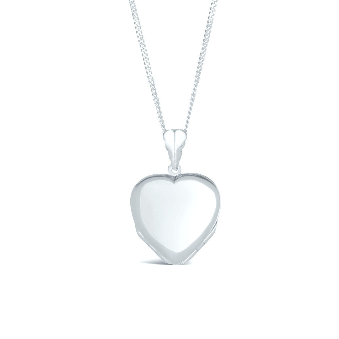 closed four photo heart locket on a white background