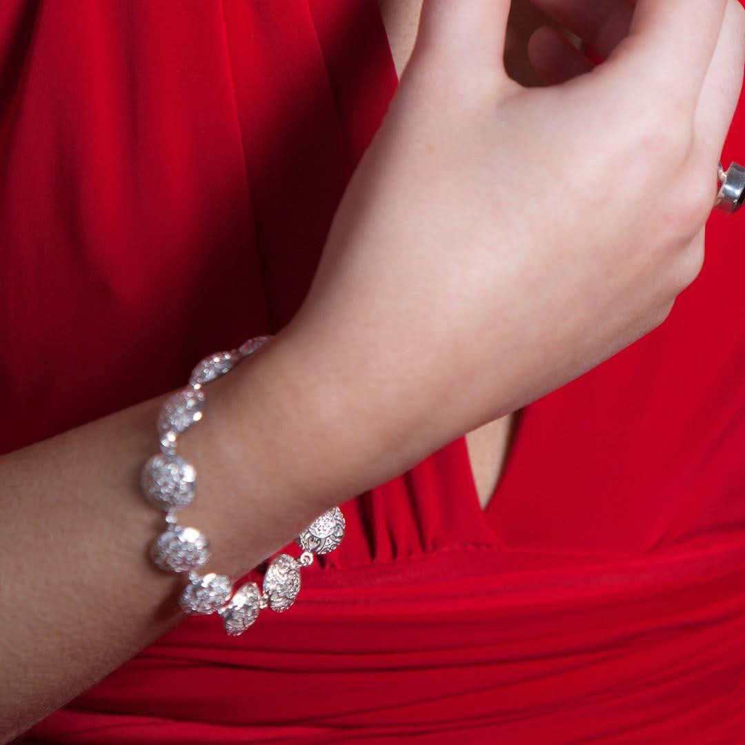 close up of model wearing memory keeper bracelet in white gold