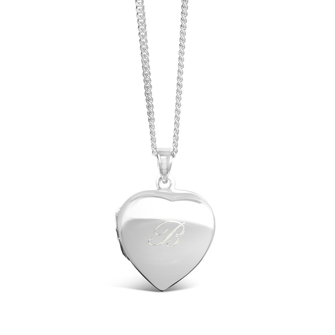 back of secret silver heart locket engraved with message