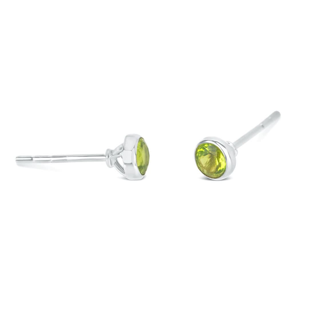 peridot mini stud earrings in silver on a white background