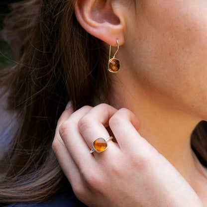 close up of model wearing citirne earrings in rose gold 