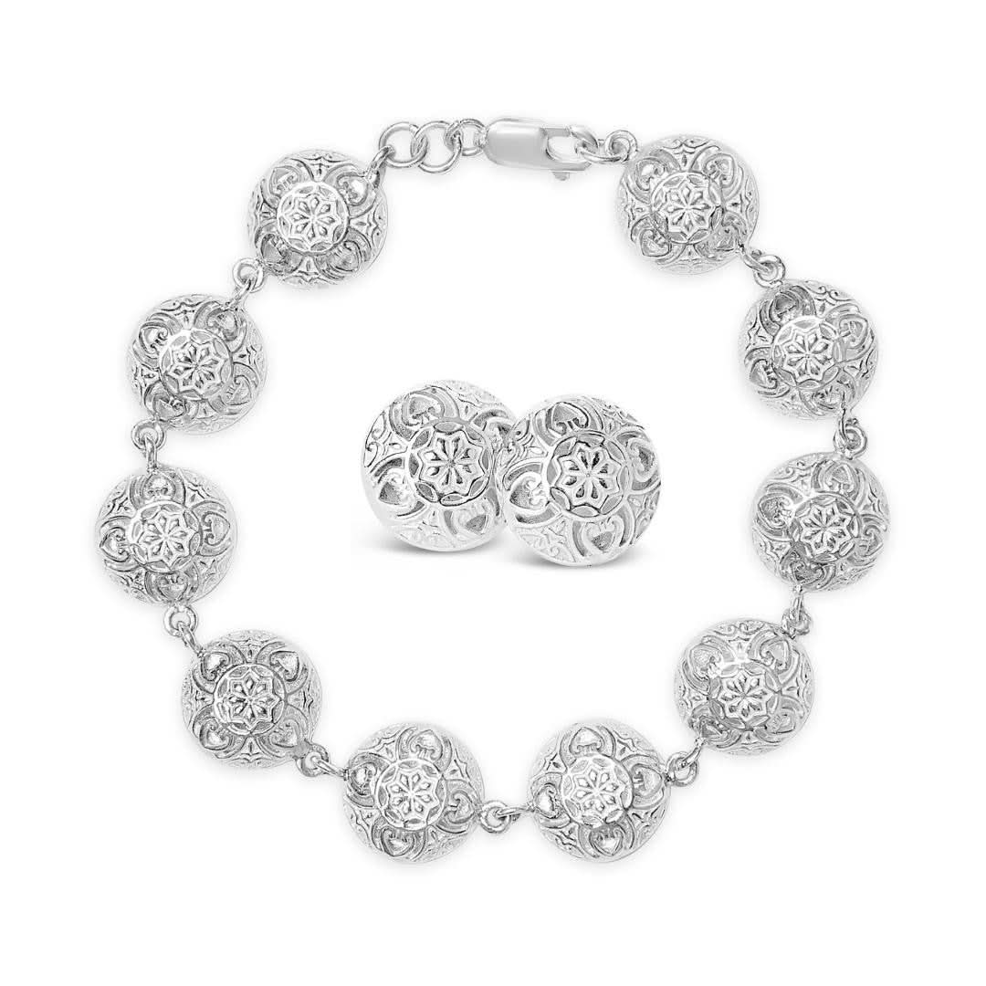 memory keeper earrings and bracelet on a white background