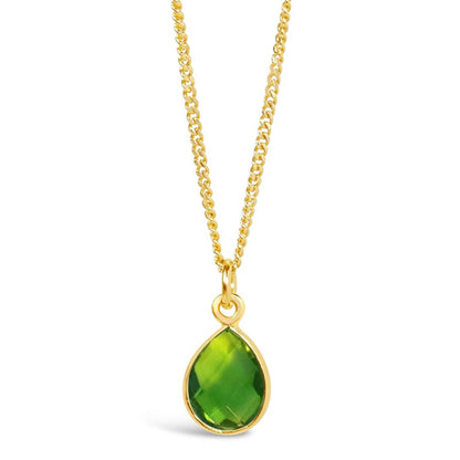 genuine green peridot gold pendant necklace on gold chain on a white background