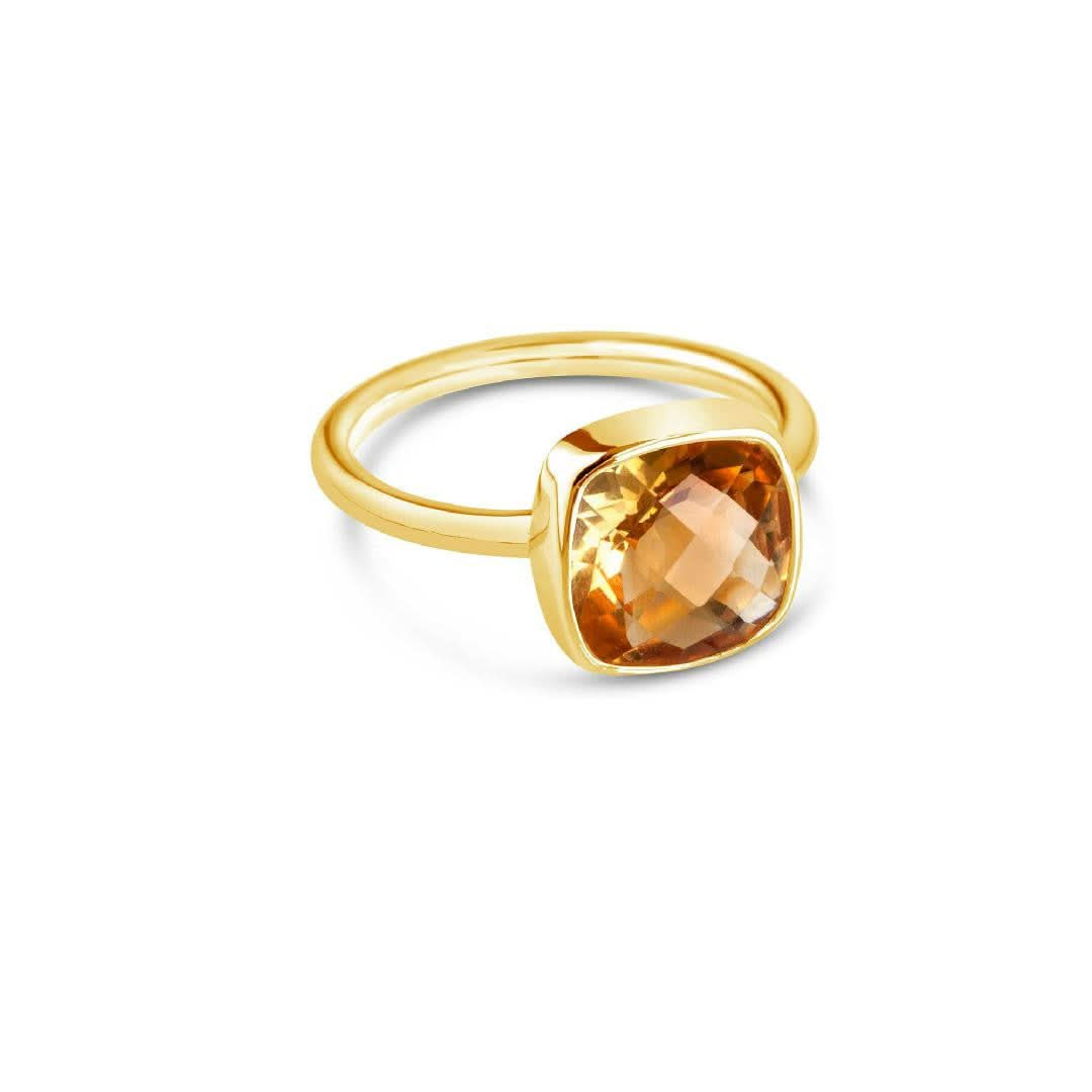 citrine cocktail ring in gold on a white background