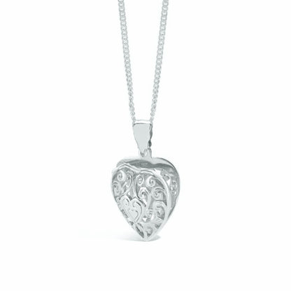 white gold heart locket from a side view on a white background