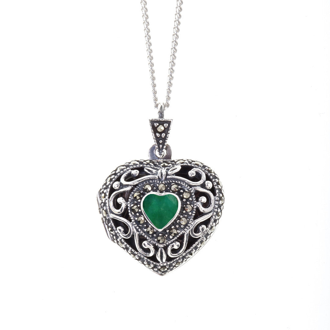 emerald vintage heart locket in white gold on a white background