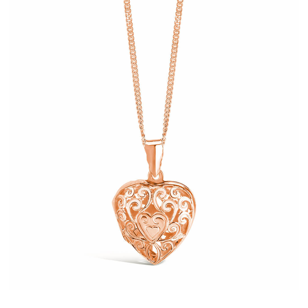 heart locket necklace in rose gold on a white background