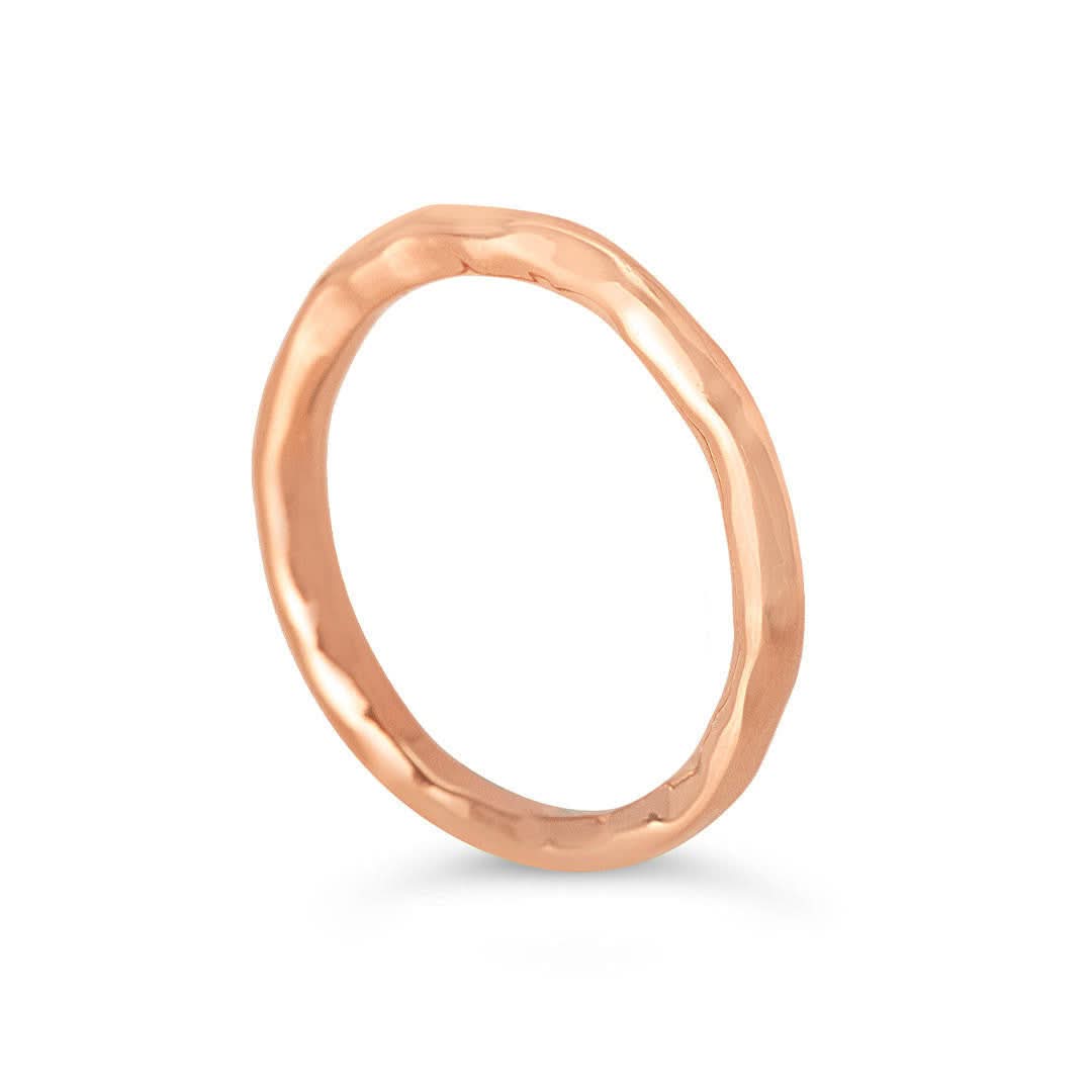 rose gold friendship band ring on a white background