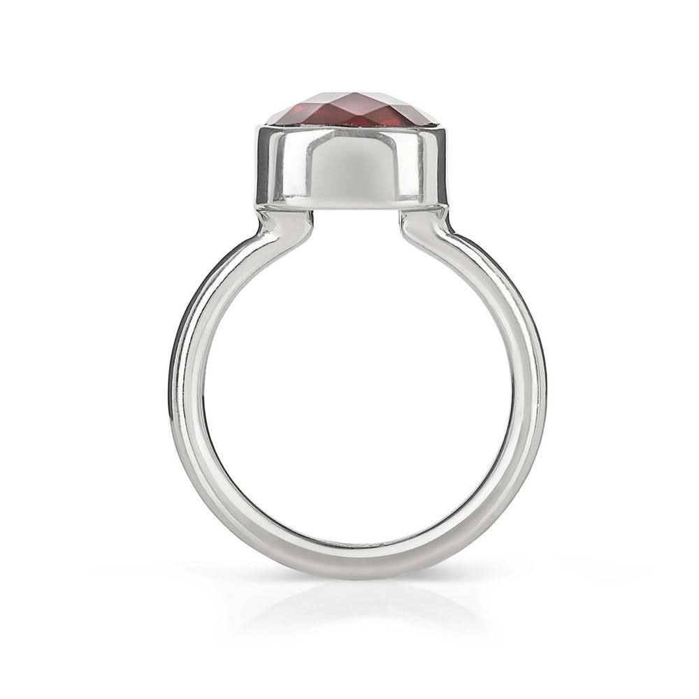 garnet cocktail ring in silver on a white background