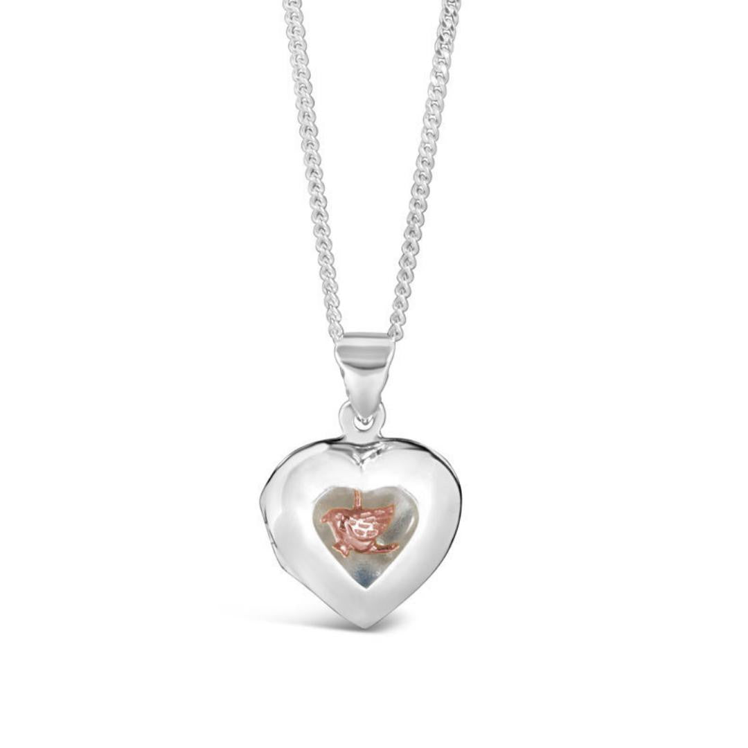 song in my heart locket in rose gold on a white background