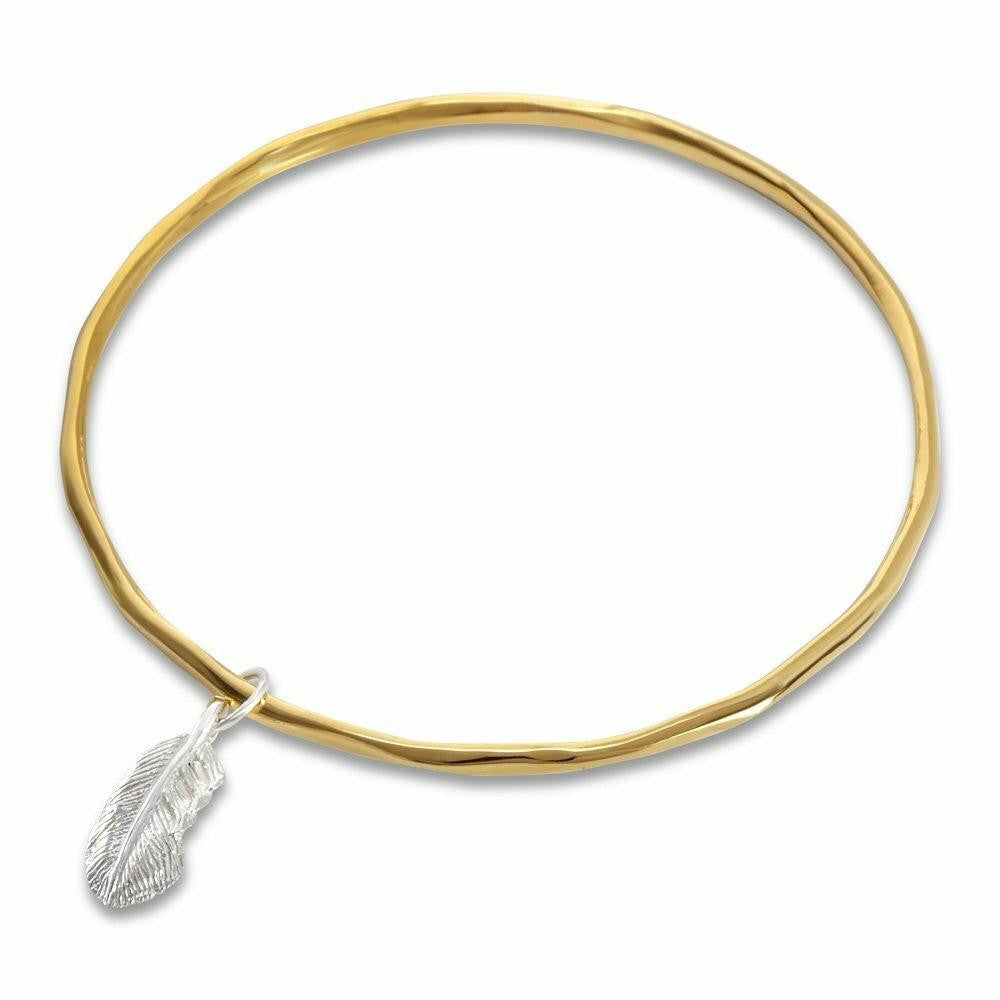 gold bangle with silver feather charm on a white background