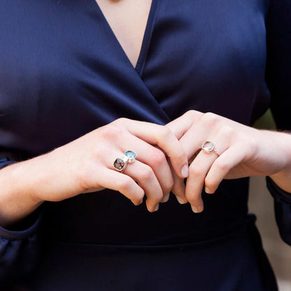 model wearing blue topaz cocktail ring 