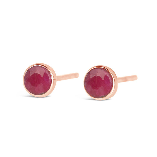 ruby mini stud earrings in rose gold on a white backgrounds