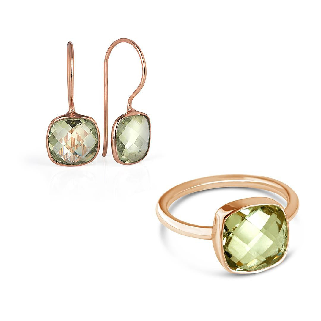 green amethyst cocktail ring and matching earrings on a white background