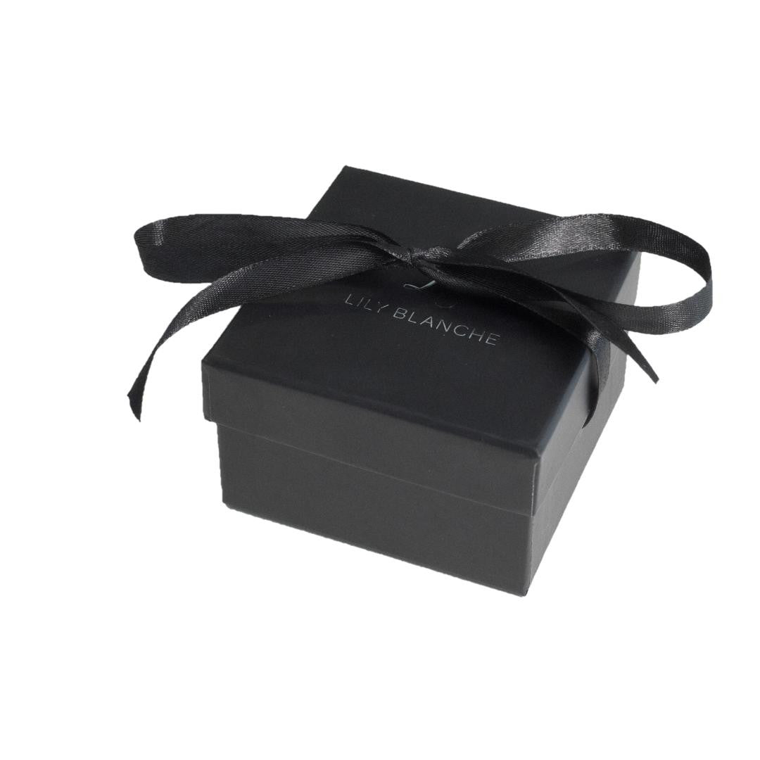 black ribbon-tied Lily Blanche gift box on a white background