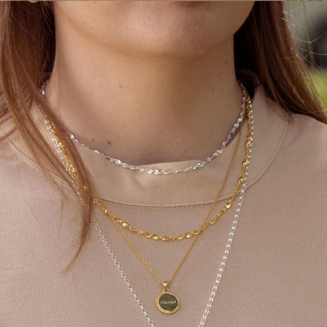 model wearing gold twist chain