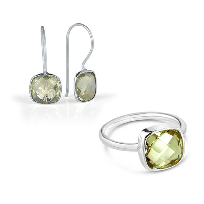 green amethyst cocktail ring and earrings in silver on a white background
