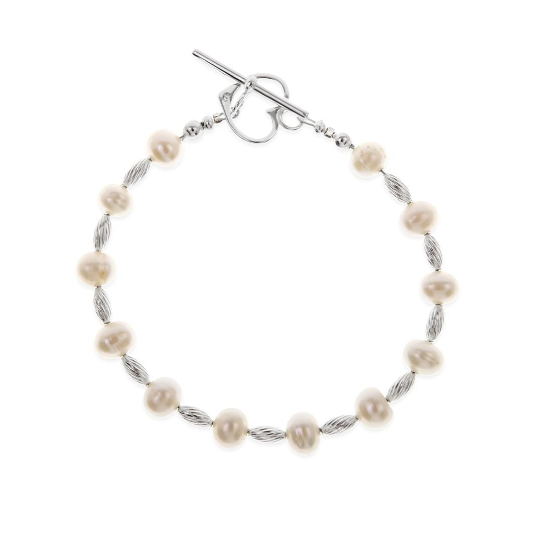 pearl charm bracelet in ivory silver on a white background