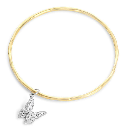 gold bangle with silver butterfly charm on a white background