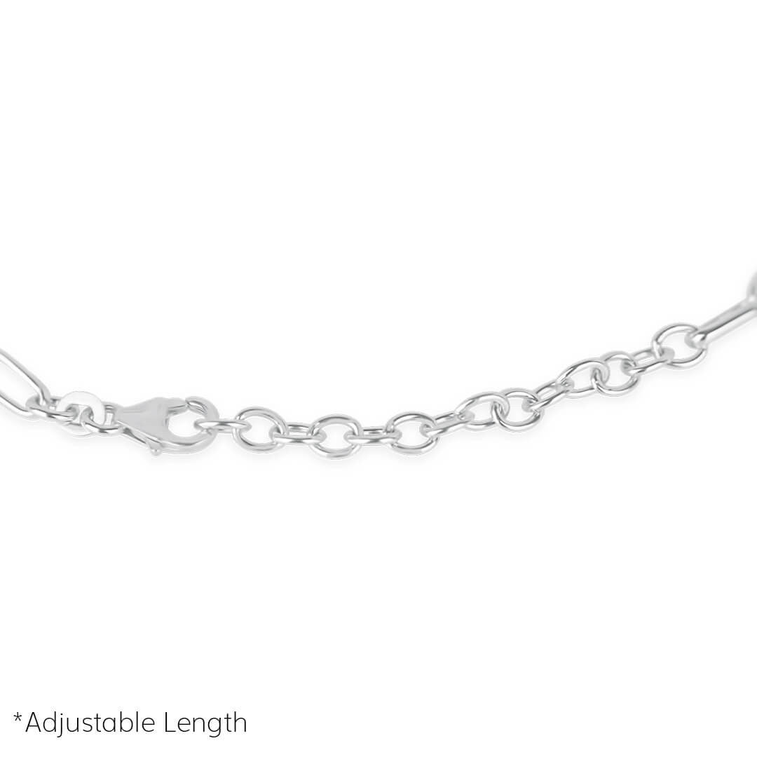close up of paperclip chain bracelet in silver on a white background
