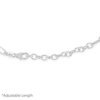 close up of paperclip chain bracelet in silver on a white background