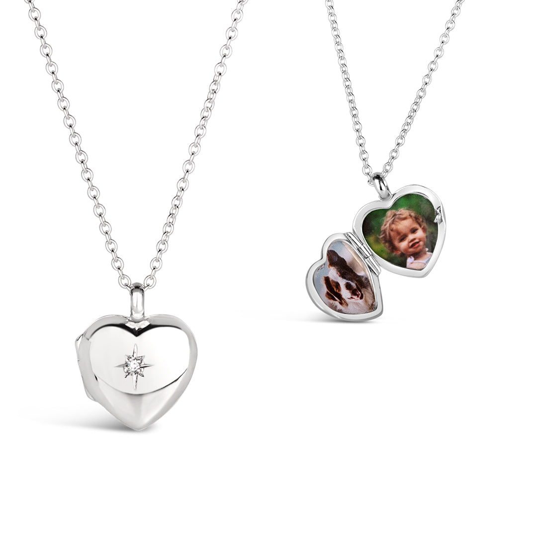 heart shaped locket with a diamond decoration on a white background on a silver chain